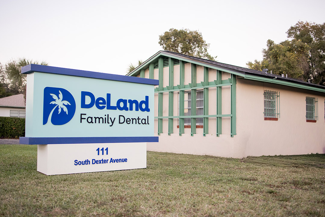 DeLand Family Dental office building and sign.